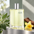 Hermès H24 on brushed metal beside sage, yellow narcissus and rosewood in soft cool daylight.