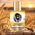 Zoologist Harvest Mouse bottle among wheat stalks, chamomile flowers and vanilla pods on weathered wood beside a golden field at sunset.