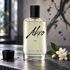 Akro Ink on a slate counter with a black ink cup and white jasmine beside an abstract ink mural.