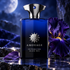 Amouage Interlude Black Iris on reflective dark stone beside a purple iris and leaf under blue moonlight.